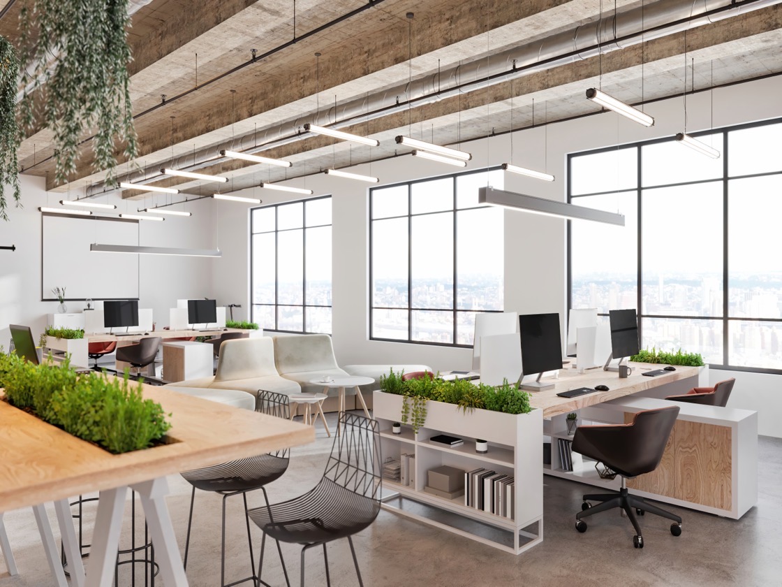 Modern office interior with natural light, workstations, and collaborative spaces in Campinas